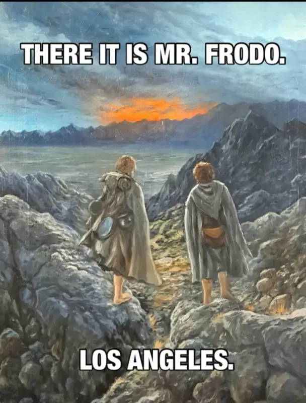 Two characters from The Lord of the Rings stand on a rocky mountain ridge overlooking a distant valley at sunset. The text…