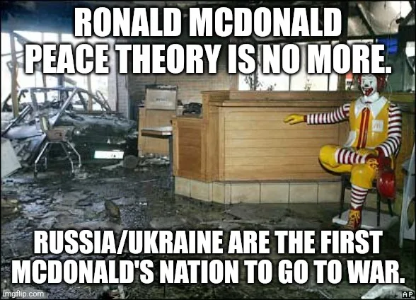 A damaged McDonald's restaurant interior with debris and a burnt-out car visible in the background. Ronald McDonald, the…