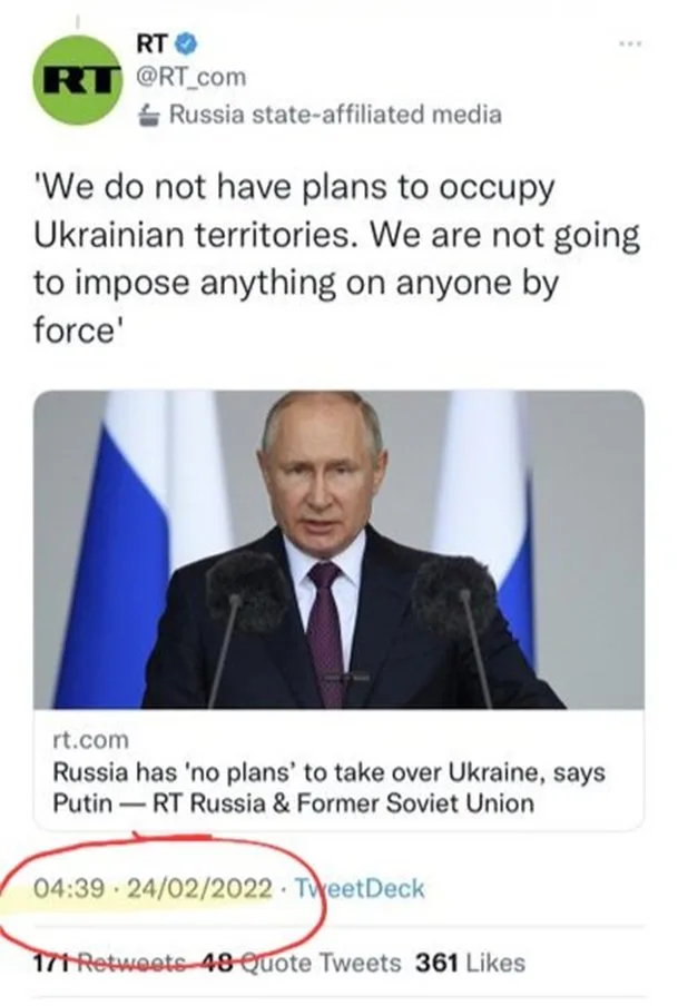 A screenshot of an RT.com tweet from February 24, 2022, showing a photo of Vladimir Putin speaking at a podium with Russian…