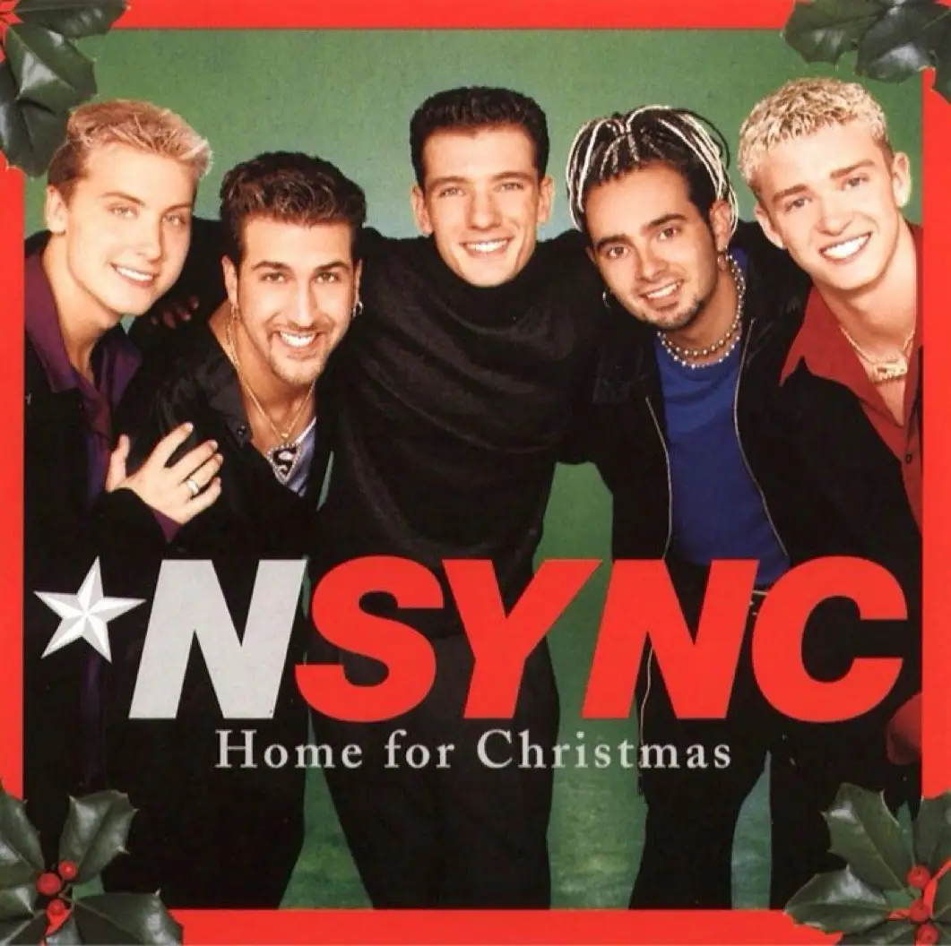 The image shows the five members of the boy band NSYNC posing together on the cover of their Christmas album 'Home for…