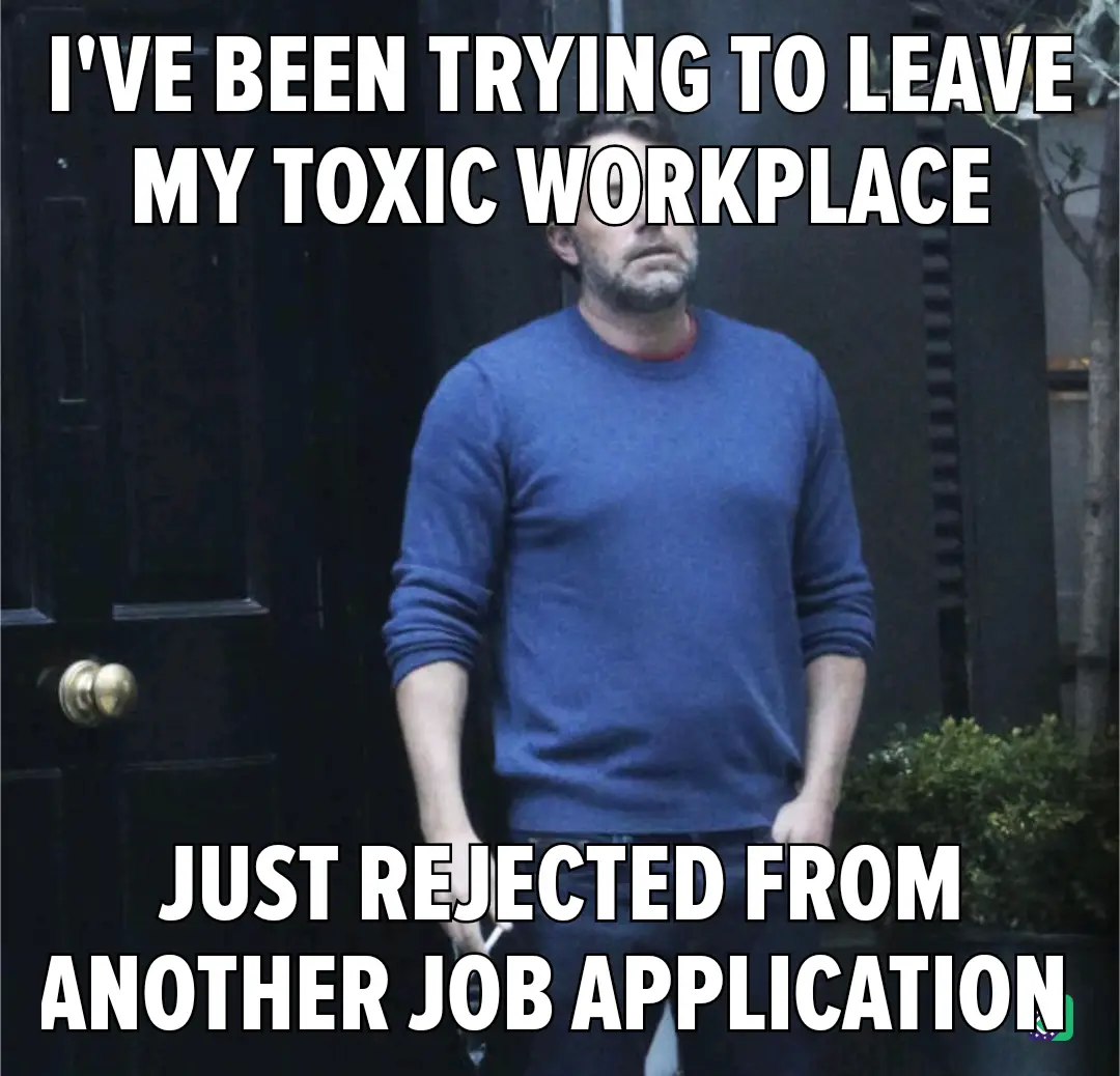 A man in a blue sweater stands in front of a dark door with a weary, defeated expression. White bold text overlays the…