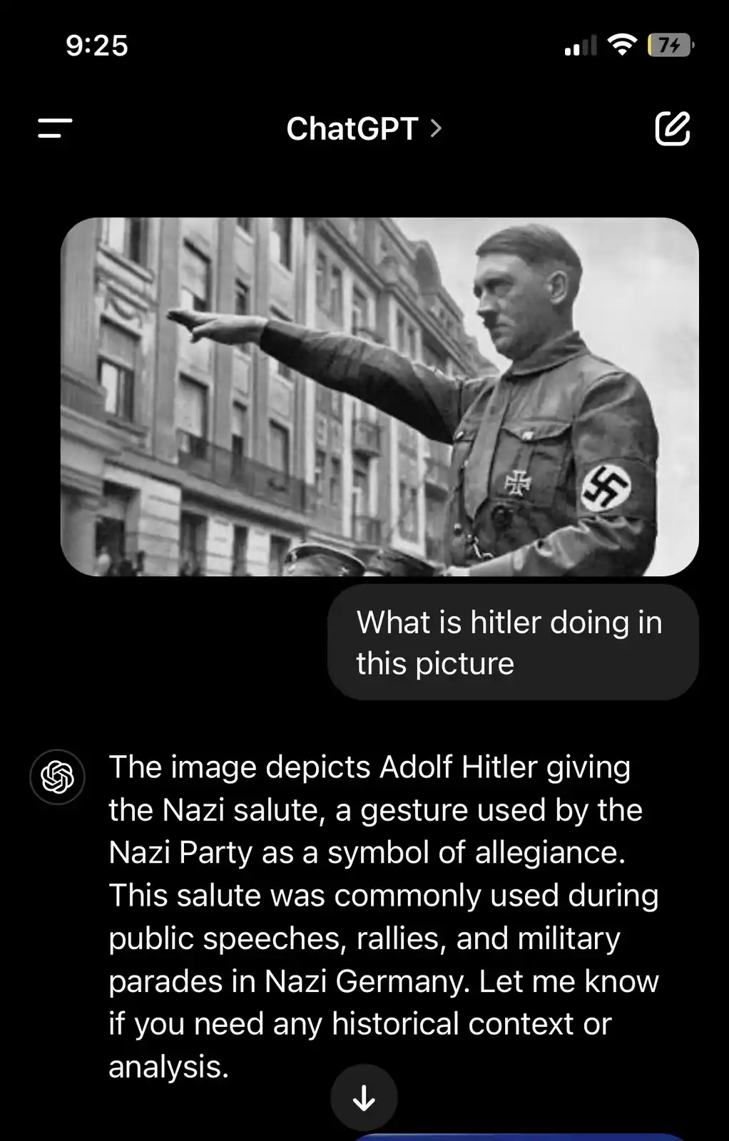 A black-and-white photo shows Adolf Hitler in a Nazi uniform with a swastika armband, giving the Nazi salute with his right…