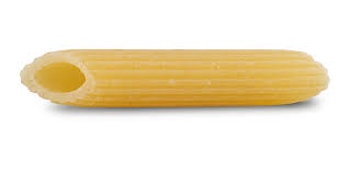 A single, dry, yellow penne pasta noodle lies horizontally against a plain white background. Overlaid text in a simple black…