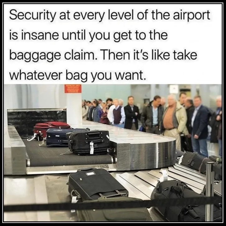 An airport baggage claim carousel with several suitcases moving along it, including red, blue, and black bags. In the…
