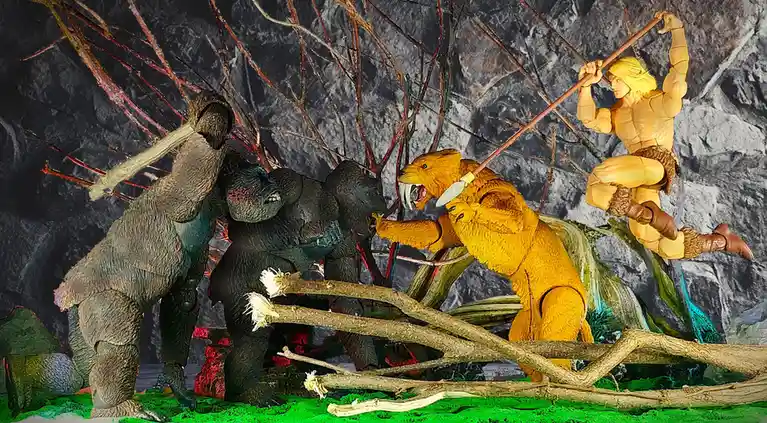A toy action figure of He-Man, with blonde hair and a spear, is posed mid-air above a chaotic scene with three ape-like…