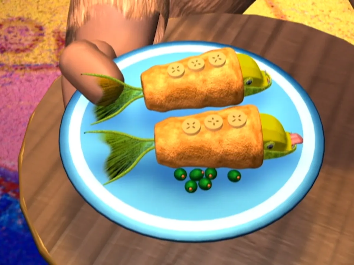 A cartoonish, low-poly 3D image shows two fried fish-shaped sandwiches on a blue plate, each with a green tail, button eyes…