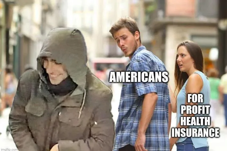A man in a hoodie looks down with a grimace while a man and woman in a plaid shirt and tank top look at him with expressions…