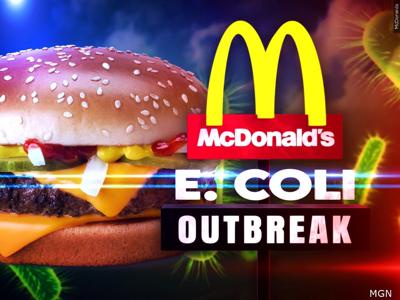A large, appetizing McDonald's hamburger with sesame seeds is shown against a dark, dramatic background with glowing green…