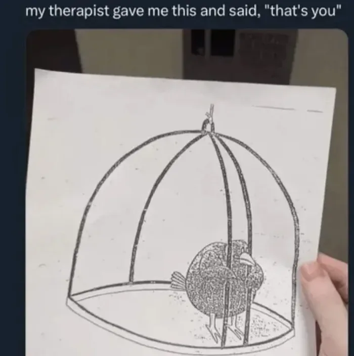 A hand holds a piece of paper with a black-and-white line drawing of a bird inside a dome-shaped cage. The bird is depicted…