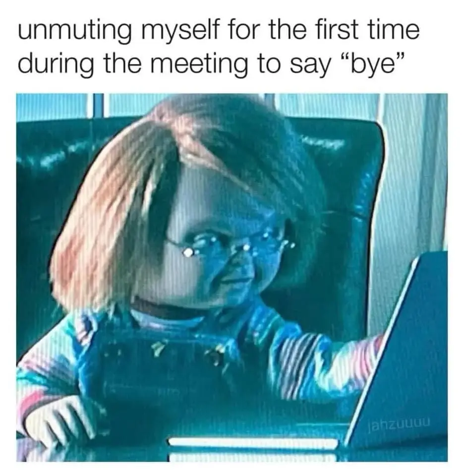 A still image of the horror doll Chucky, wearing glasses and sitting in a chair, looking at a laptop. The overlaid text…