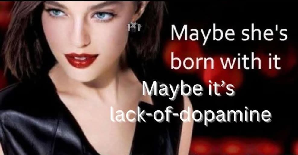 A close-up photo of a woman with blue eyes, dark hair, and red lipstick wearing a black top, with overlaid white text…