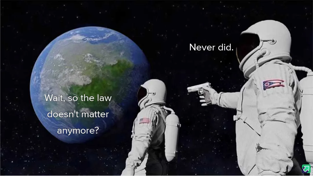 Two astronauts float in space near Earth. The astronaut on the left, facing Earth, asks, 'Wait, so the law doesn't matter…