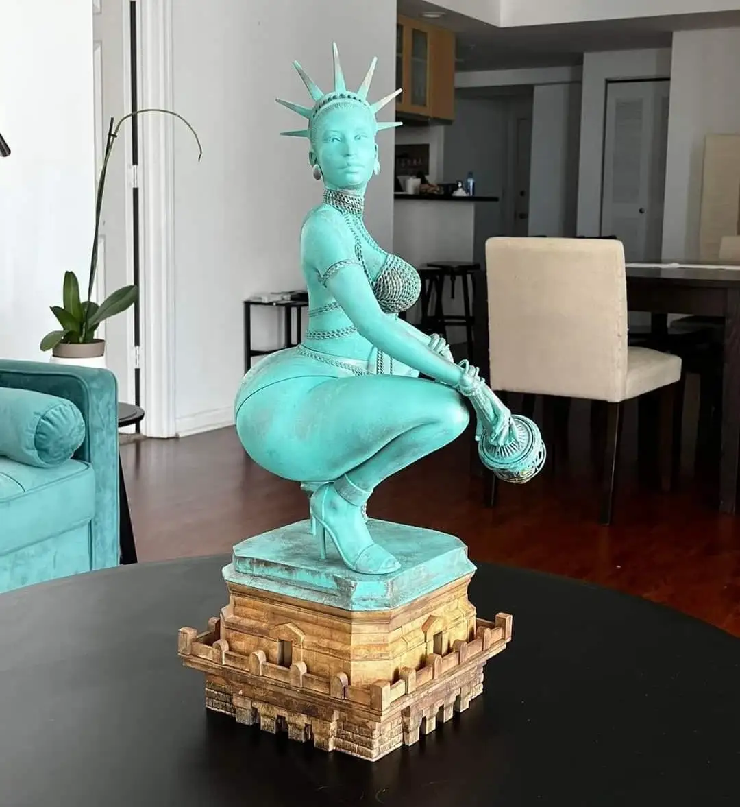A turquoise statue of the Statue of Liberty is depicted in a provocative squatting pose on a pedestal, wearing high heels…