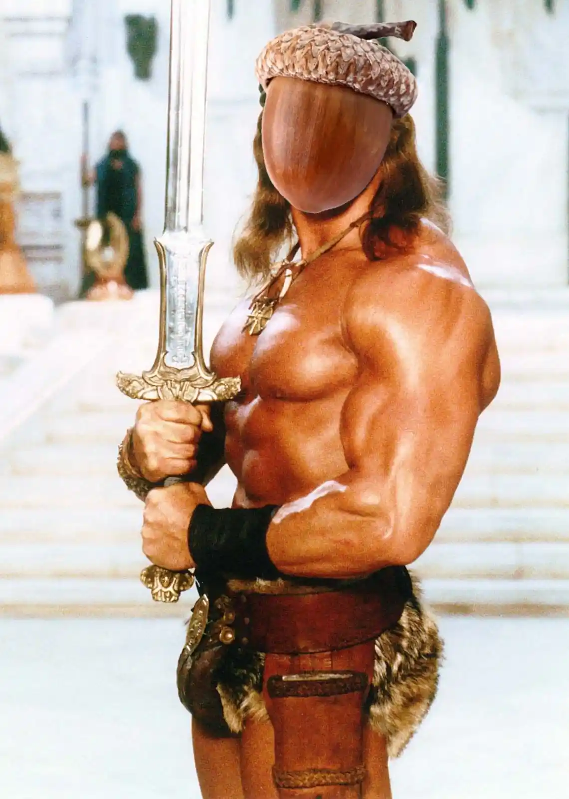 A muscular, shirtless man with long hair and an acorn-shaped wooden head stands holding a large ornate sword. He wears a…