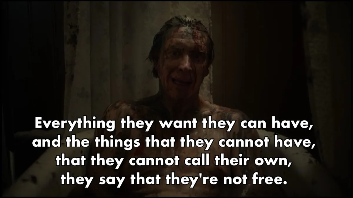 A man with bloodied face and torso sits in a bathtub, looking distressed. White text overlaid on the image reads…