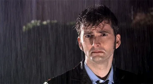 five panels show actor david tennant as the doctor from doctor who standing in the rain, his expression progressively…