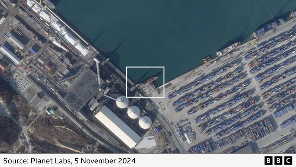 This satellite image from Planet Labs, dated 5 November 2024, shows a vast industrial port with massive container ships and…