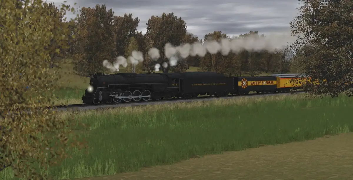 A black steam locomotive with the text 'Chessie System Railroads' and number '614' pulls a yellow passenger car labeled…