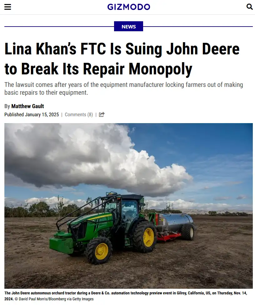 A green John Deere tractor with yellow wheels is parked in a dirt field under a partly cloudy sky, pulled by a silver tank…