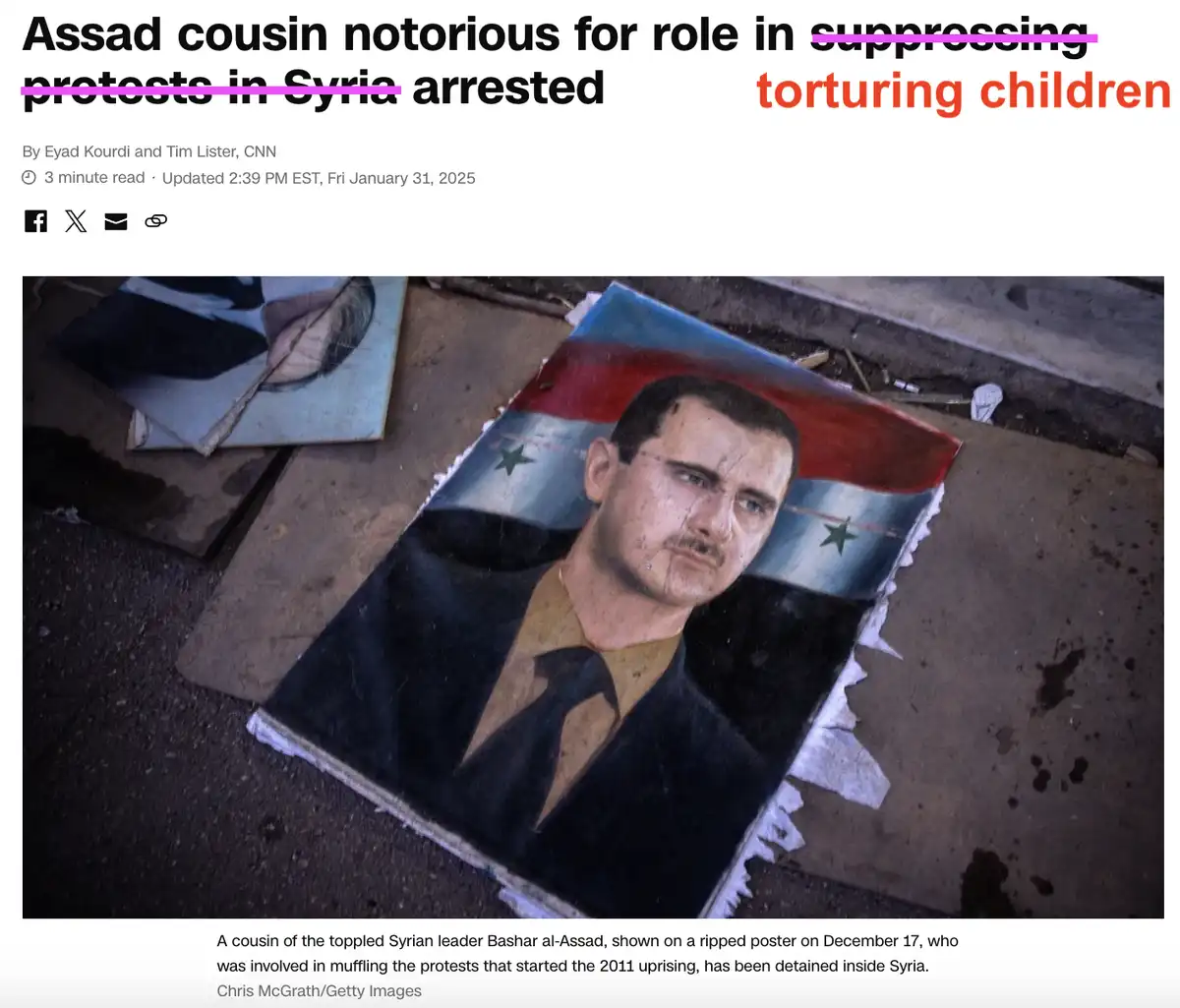 A ripped poster of a man with a mustache and glasses, wearing a suit and tie, lies on the ground with the Syrian flag behind…