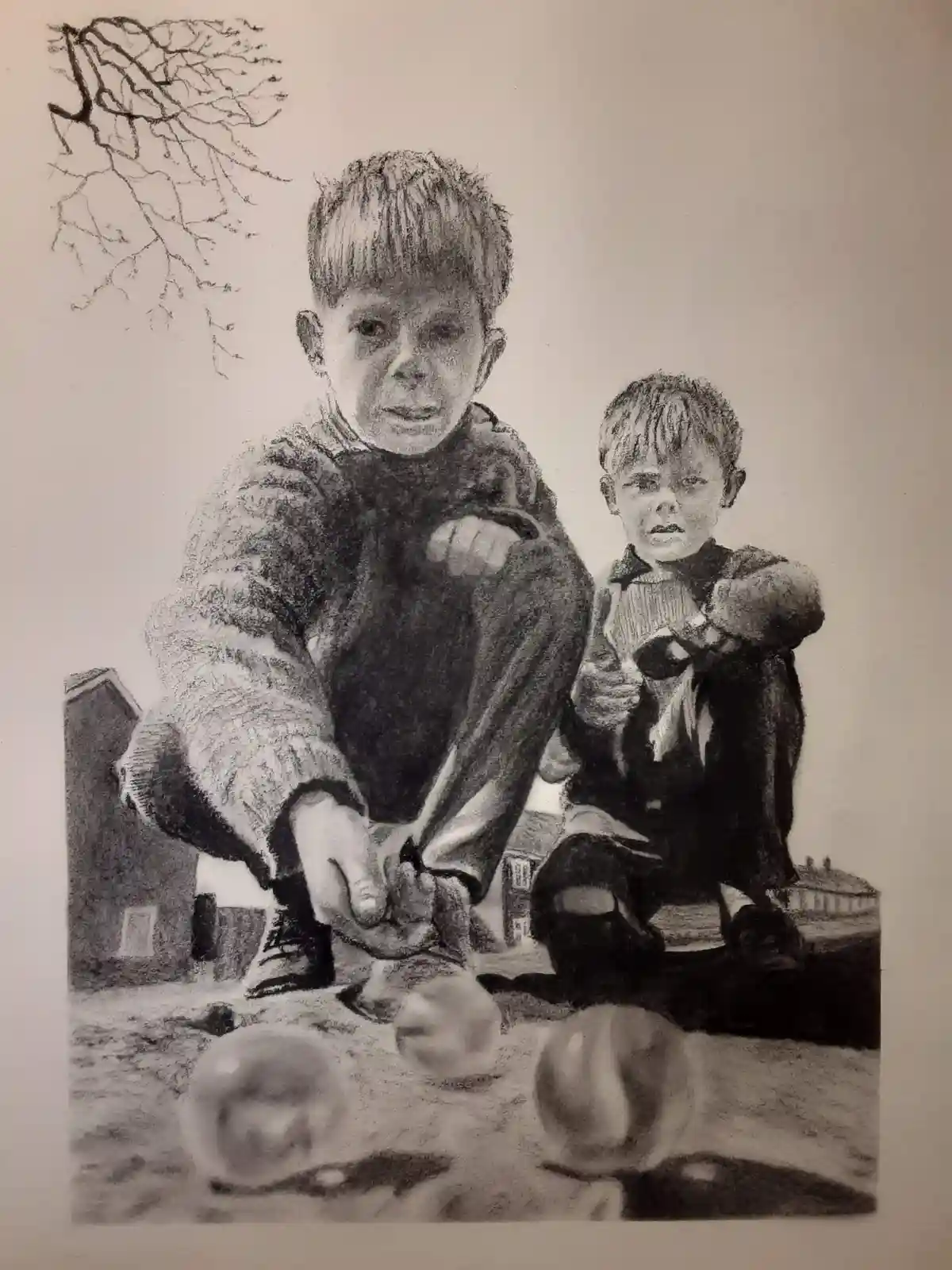A black-and-white pencil drawing shows two young boys crouching outdoors, intensely focused on playing marbles on the…