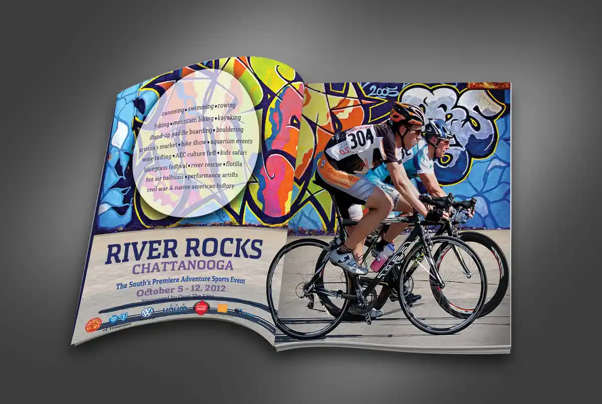 An open brochure for 'River Rocks Chattanooga' shows a photo of two cyclists racing in front of a colorful graffiti wall on…