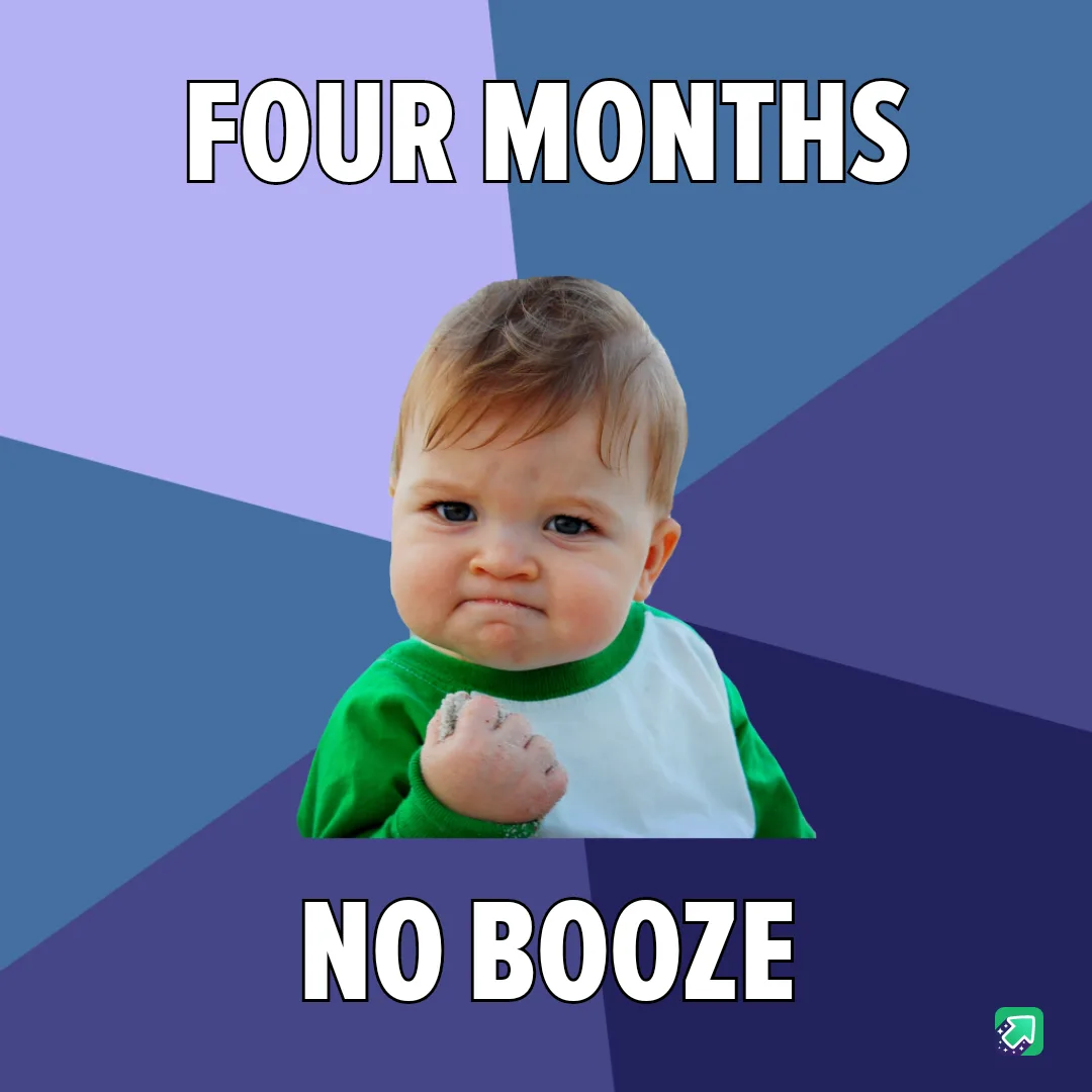A baby with a scrunched face and clenched fist, wearing a green and white shirt, is centered on a geometric background of…
