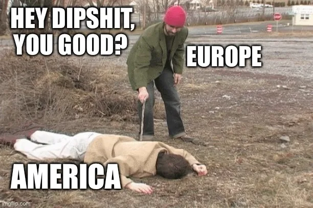 A man in a red beanie and green jacket stands over another man lying motionless on the ground, holding a stick. Text labels…