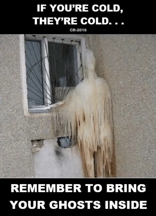 A person is frozen solid, forming a translucent, icicle-covered humanoid shape clinging to the exterior wall beside a…