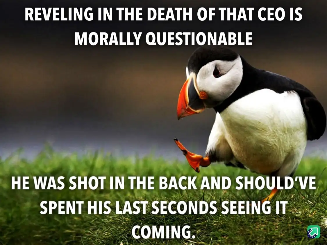 A photograph of a puffin standing on green grass, looking down with a slightly smug or self-satisfied expression. The image…