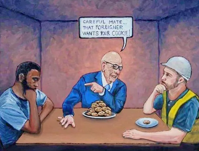 Three men sit at a table; a middle-aged man in a blue suit points accusingly at a plate of cookies while speaking. The man…