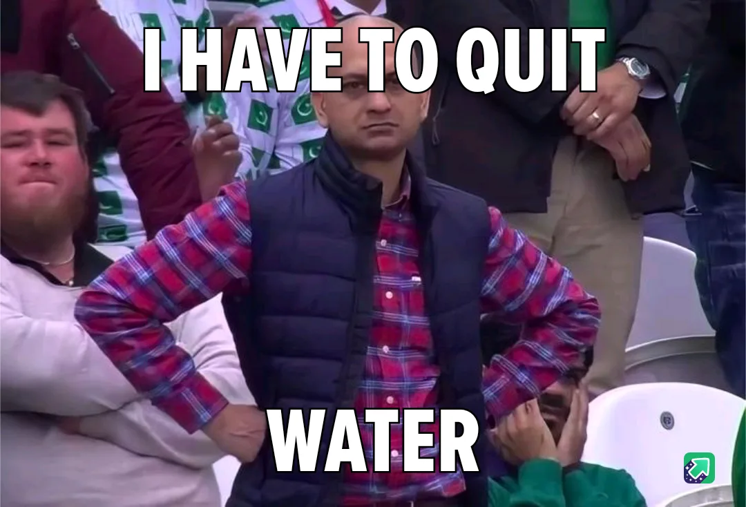 A man in a red plaid shirt and black vest stands with hands on hips, looking intensely serious. The text overlaid on the…