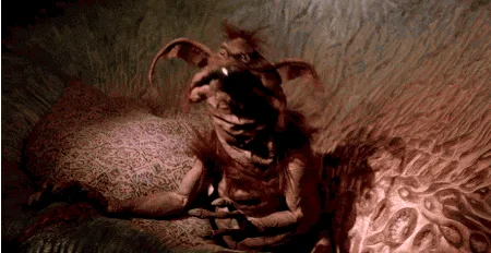 A six-panel image strip shows a grotesque, furry, bat-eared creature with a wide mouth and sharp teeth, sitting on a…