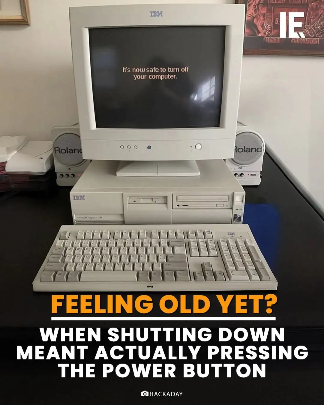 An old IBM personal computer setup with a beige monitor, tower, and keyboard sits on a desk. The monitor displays the…
