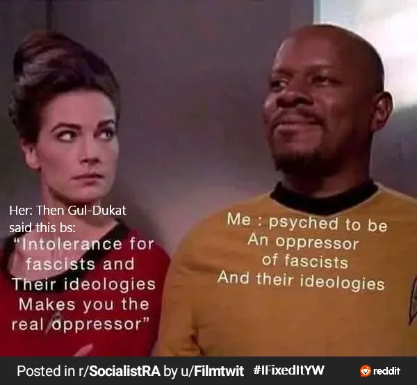 A still from Star Trek: Deep Space Nine shows two characters, a woman in a red uniform looking skeptical and a man in a…