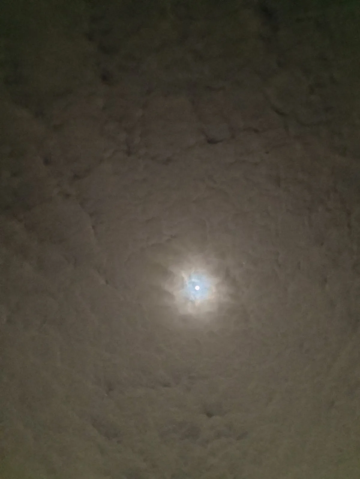 A dimly lit, textured ceiling with a single bright, star-like light fixture in the center. The overlaid text reads 'i'm not…