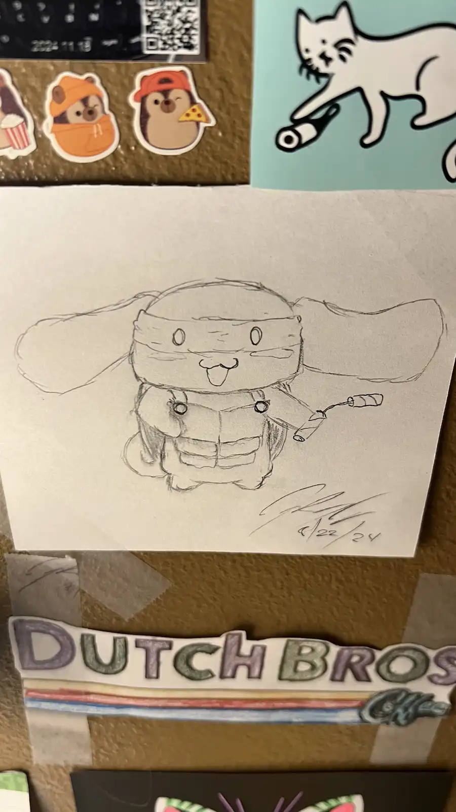 A hand-drawn pencil sketch of a cute, chibi-style character resembling a ninja with large ears, a headband, and a vest…