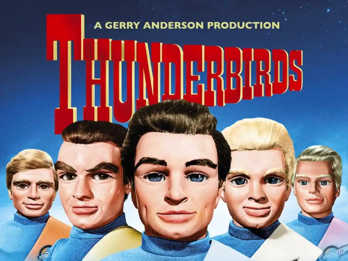 The image is a promotional poster for the Gerry Anderson production 'Thunderbirds,' featuring five identical-looking male…