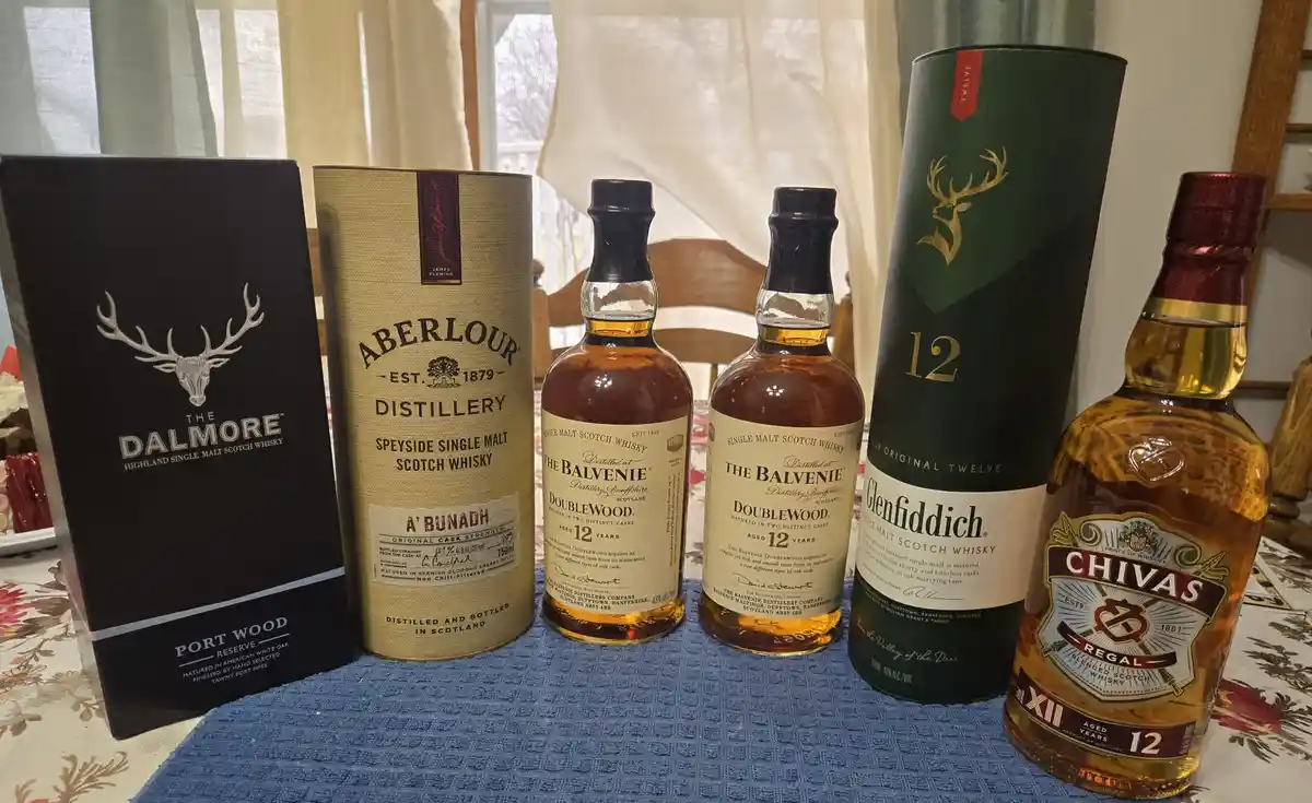 Five bottles of premium whiskey — The Dalmore, Aberlour A'Bunadh, two bottles of The Balvenie DoubleWood, Glenfiddich 12…