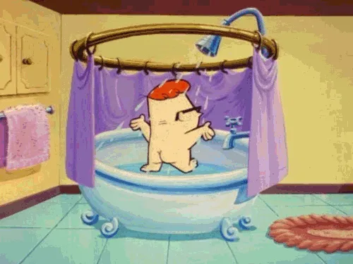 A cartoon bear with a red beret and sunglasses is in a bathtub under a shower, visibly annoyed as water sprays from the…