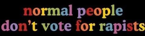 The image displays the text 'normal people don't vote for rapists' in a colorful, rainbow-gradient font against a solid…