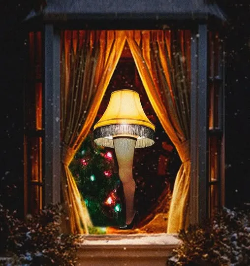 A leg lamp, famously from the movie 'A Christmas Story,' is shown standing in a window with curtains drawn back, revealing a…