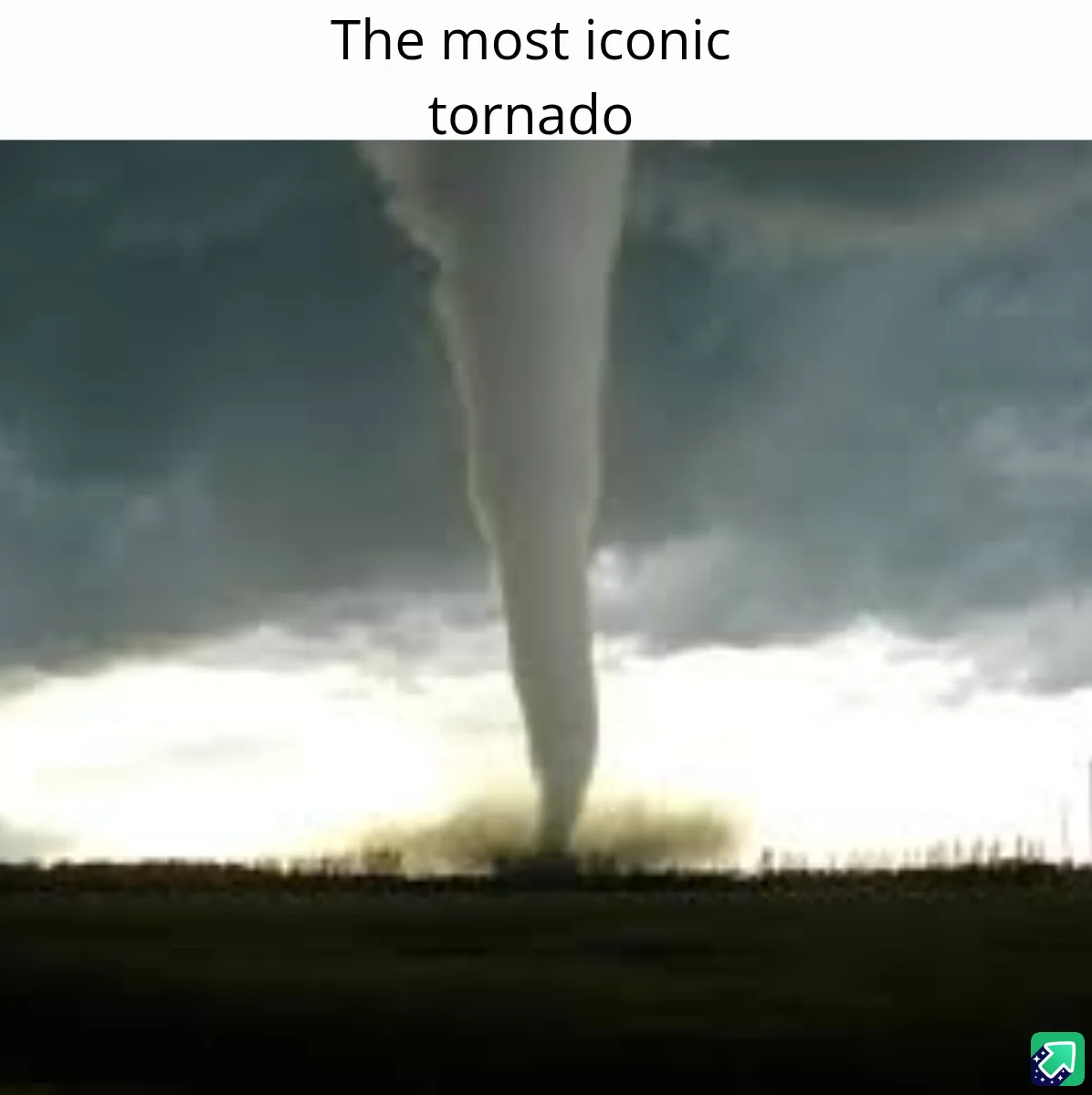 A photograph of a large, powerful tornado funnel cloud descending from dark storm clouds onto a flat, open landscape. The…