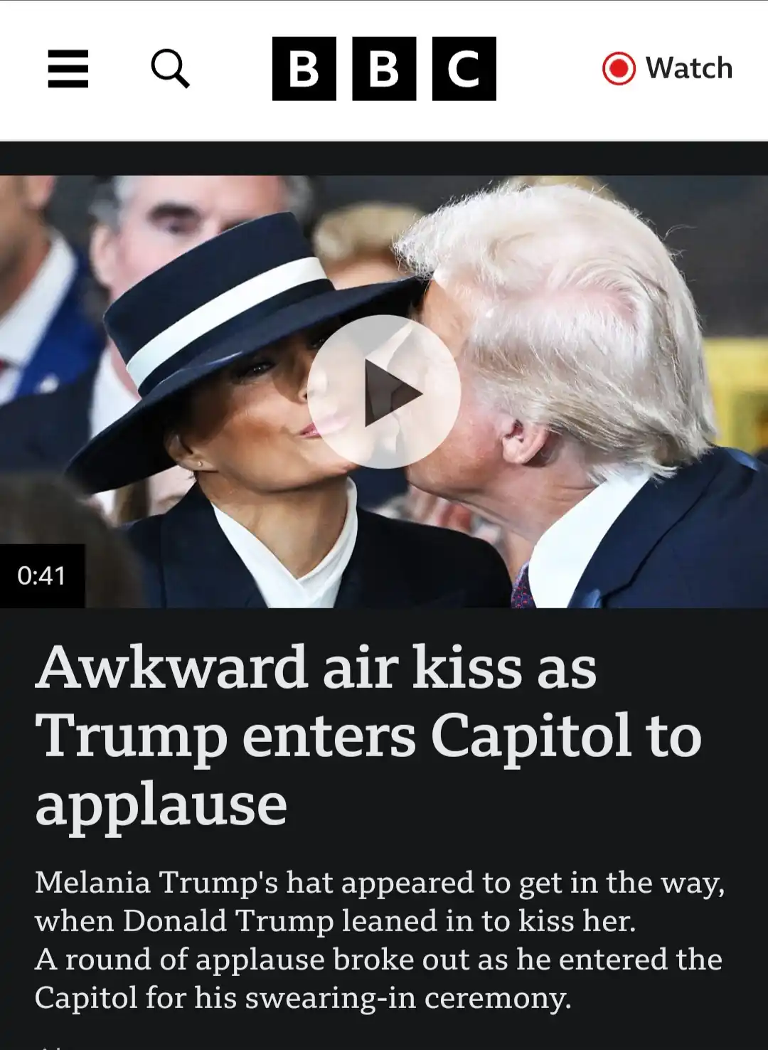 A screenshot of a BBC video thumbnail shows Donald Trump leaning in to kiss Melania Trump on the cheek, but her hat…