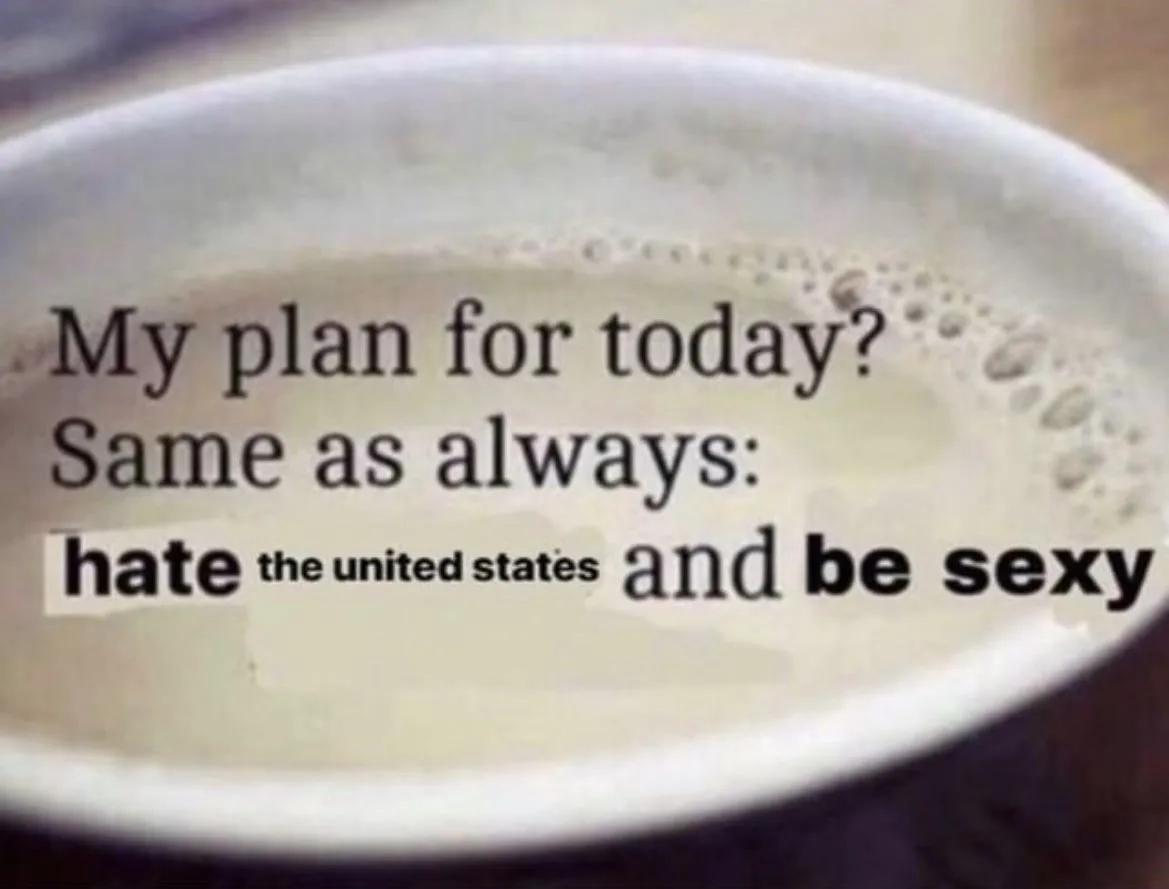 A close-up image of a white ceramic mug filled with light-colored liquid and foam, with black text overlaid. The text reads…