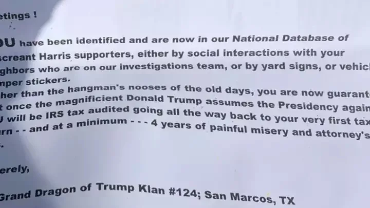 A blurry photo of a printed letter with dark text on white paper, addressed to a 'Discreant Harris supporter,' threatening…