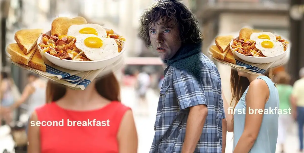A man with curly hair and a plaid shirt stands between two women, each with a large breakfast plate (fried eggs, bacon…