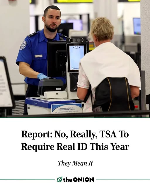 A TSA agent in a blue uniform and gloves stands behind a checkpoint scanner, looking at a passenger with a backpack who is…