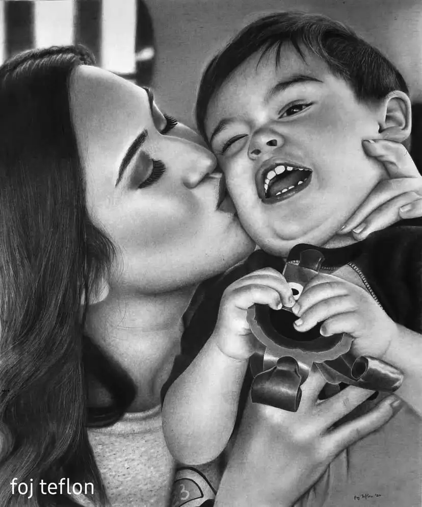 A black-and-white hyperrealistic drawing shows a woman kissing a young child on the cheek while the child laughs joyfully…