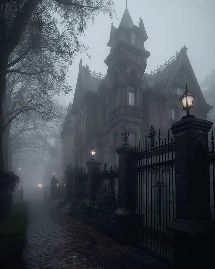 a foggy, eerie Victorian mansion with a wrought iron fence and lit lanterns, overlaid with the text 'this is the house that…